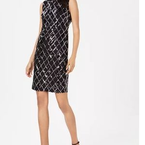 Round neckline; Sheath silhouetteHidden back zipper closureAllover sequins in